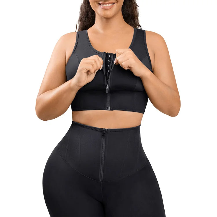 Woman wearing a black compression outfit on a white background