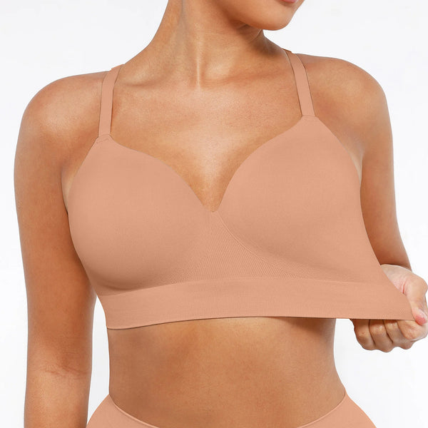 Beige sports bra worn by a person on a white background
