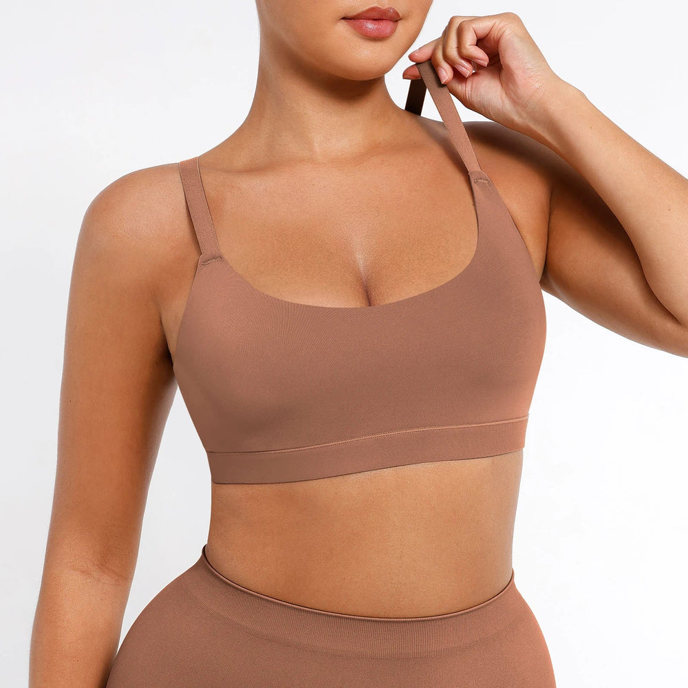 Woman wearing a brown sports bra and leggings