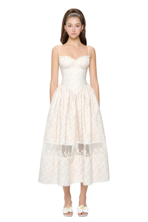 White lace dress worn by a model on a white background