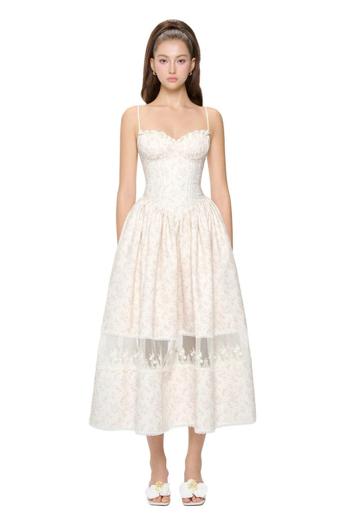 White lace dress worn by a model on a white background