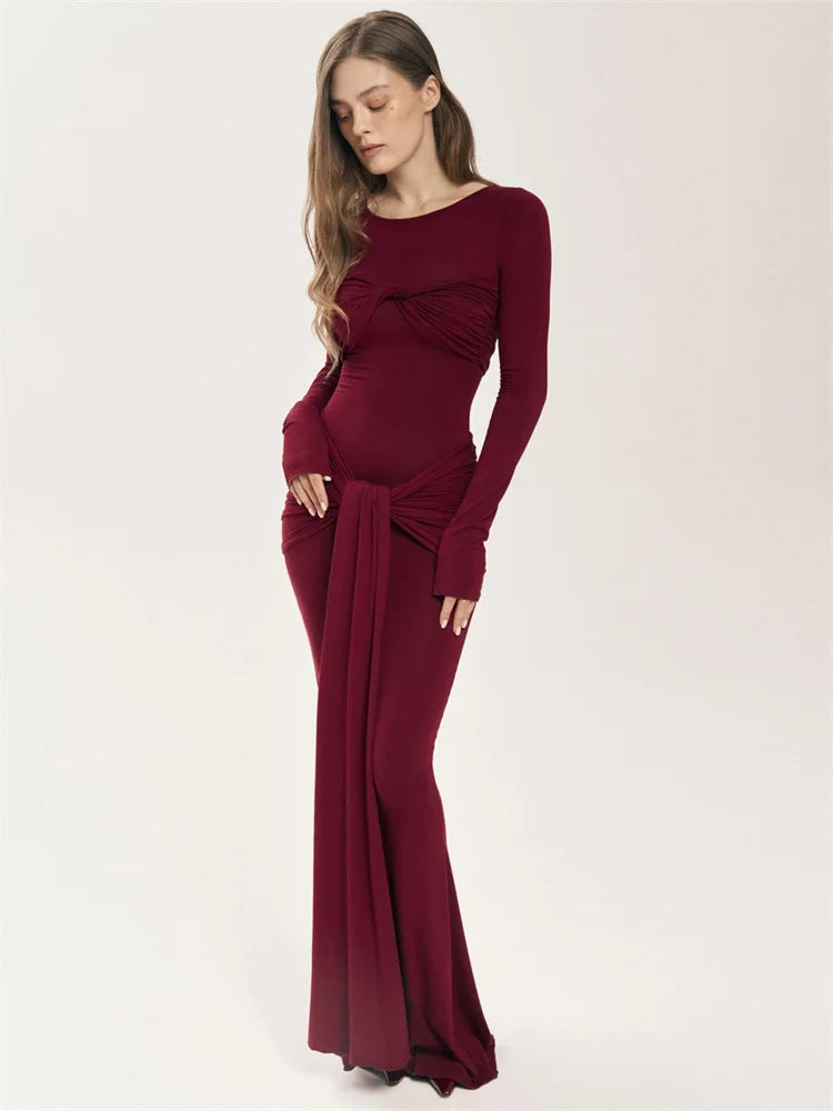 Become a trendsetter with our Oslo Maxi Dress! This bold and adventurous dress features a unique patchwork twist design, flattering slim fit, and long sleeves for a 