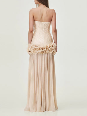 Beige strapless gown with floral details on a white background