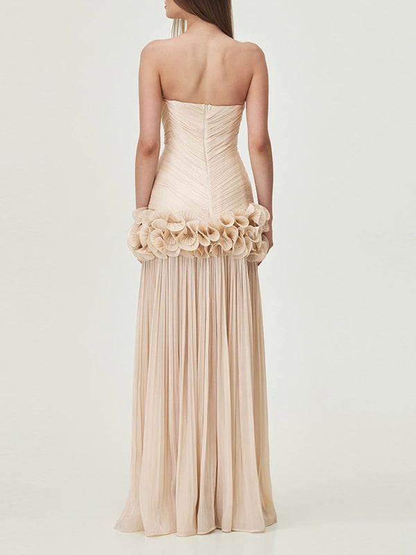Beige strapless gown with floral details on a white background