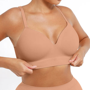 Person wearing a beige compression garment on a white background