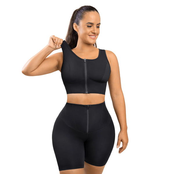 Woman wearing a black compression outfit on a white background