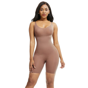 Woman wearing a brown bodysuit against a white background