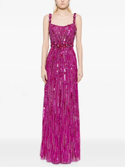 Woman wearing a pink sequin dress on a white background