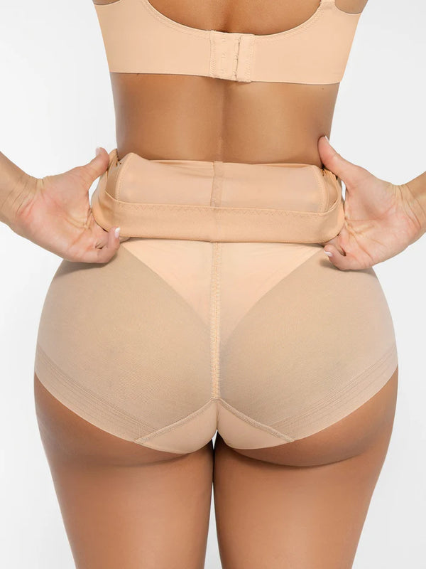 Beige shapewear being worn on a plain background